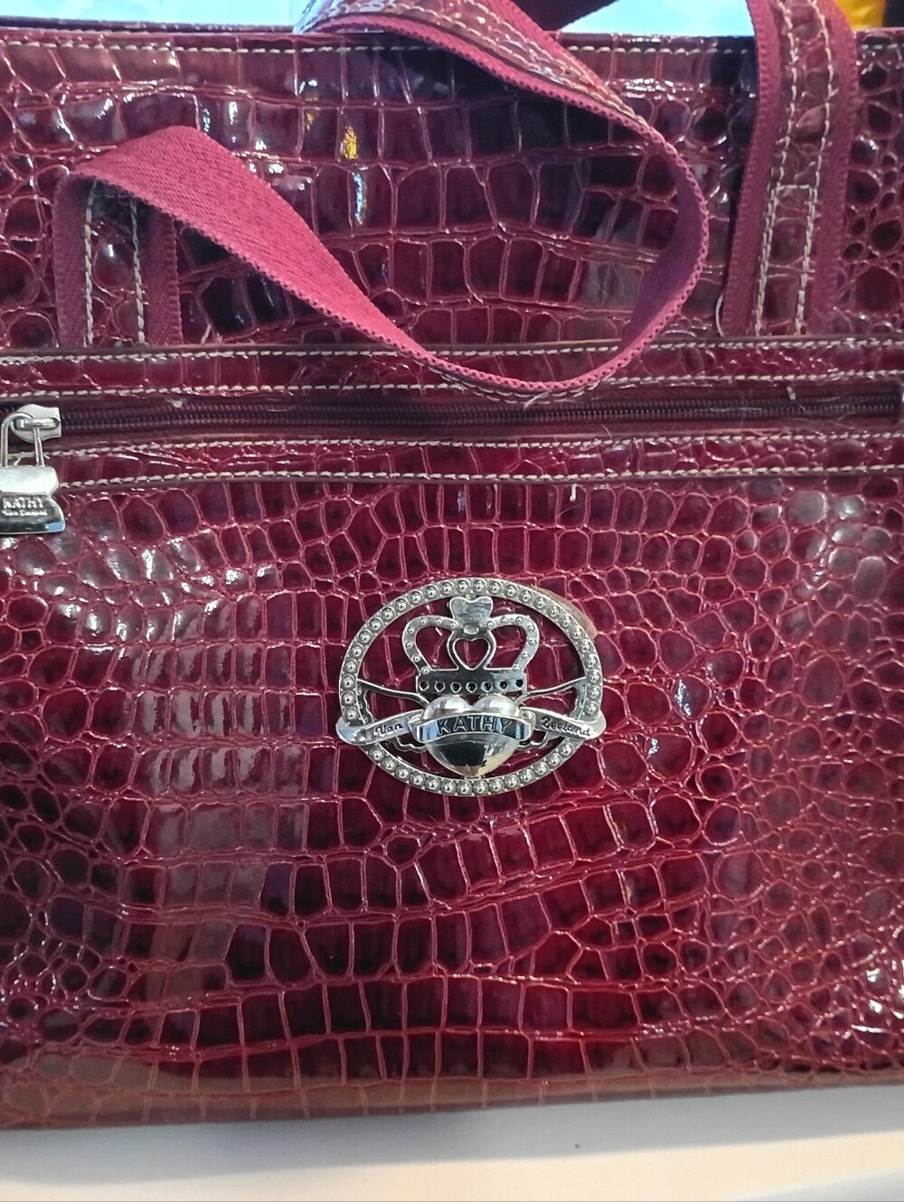 Kathy Van Zeeland Croc-Embossed Burgundy Tote with Decorative Crest